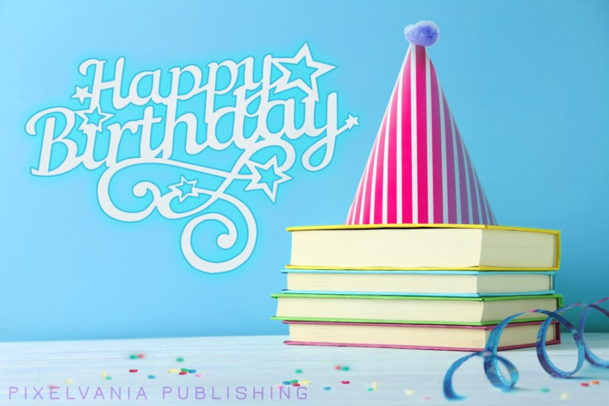Book Birthday Image - A stack of books topped with a birthday hat and surrounded by confetti
